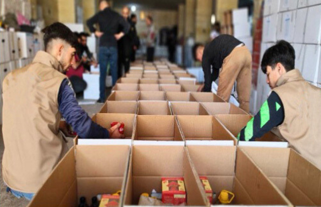 Cardboard boxes filled with relief supplies are lined up