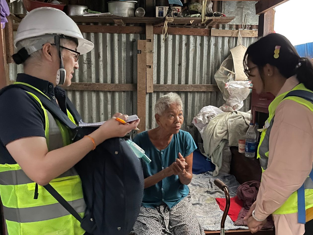 AAR staff member listening to an earthquake survivor