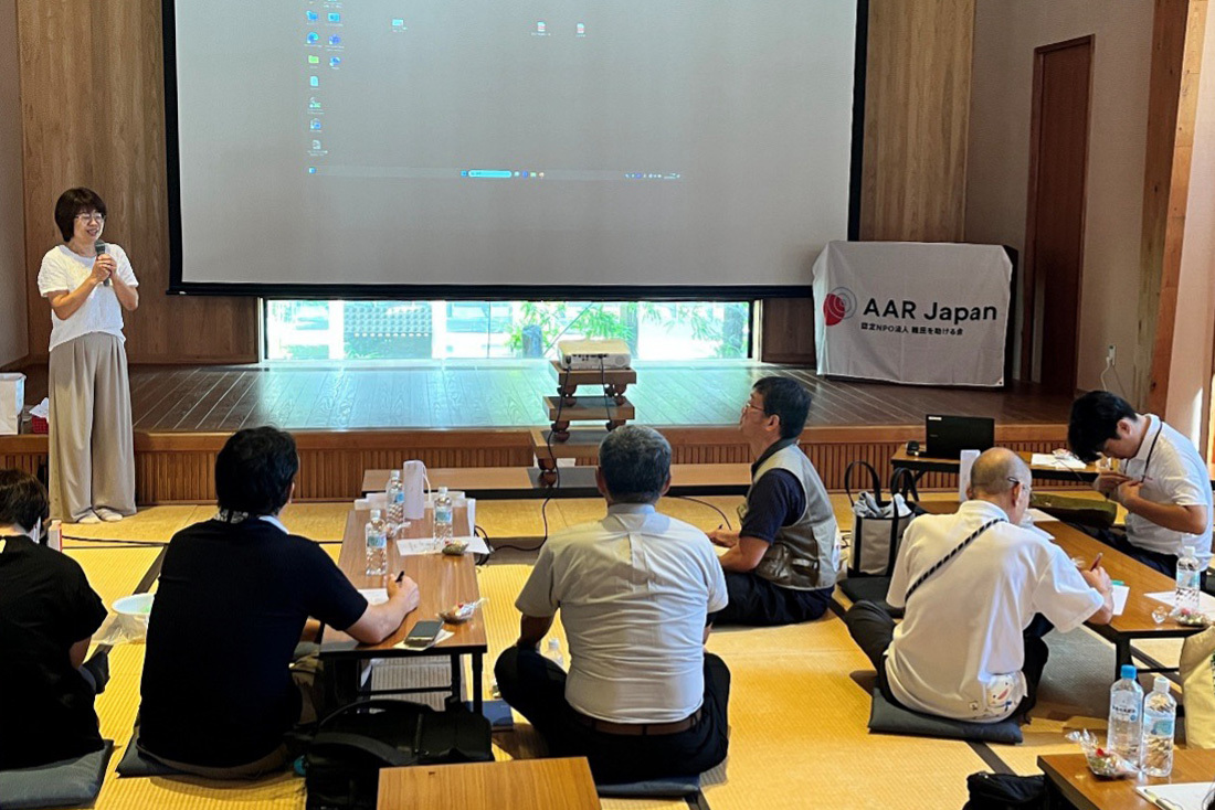 Participants listening to a speaker 