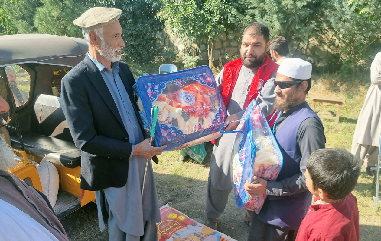 A man is receiving a package of supplies