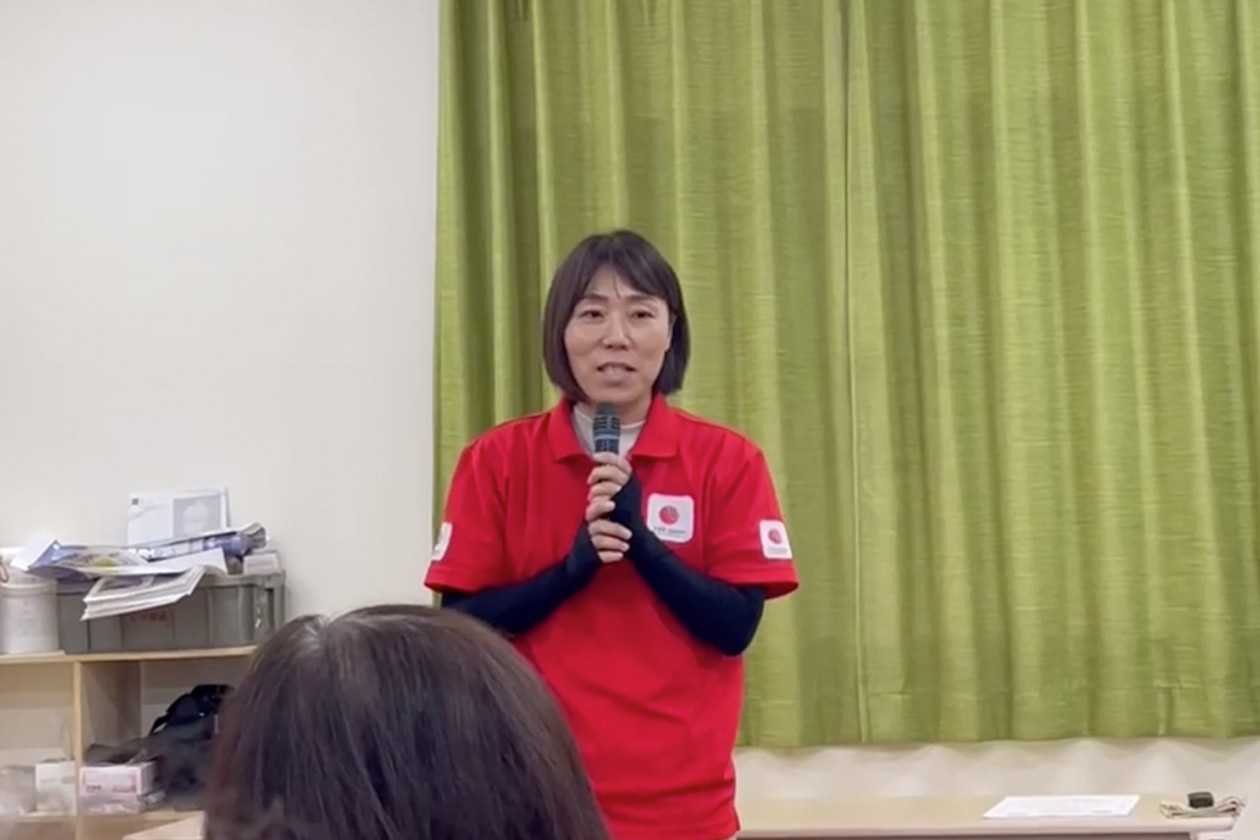 A woman speaking into a microphone